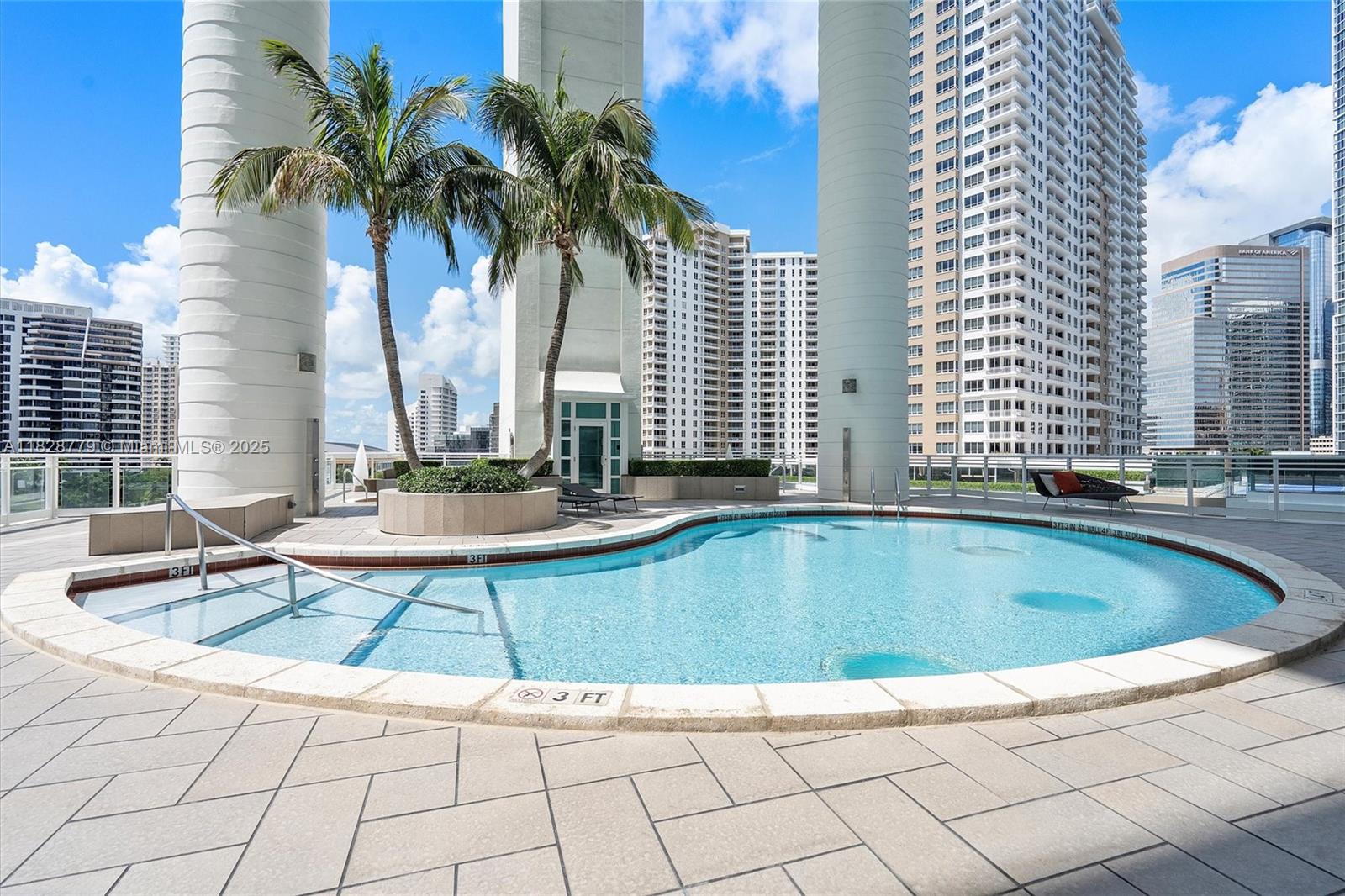 900 Brickell Key Boulevard, Unit 3103 Miami, FL 33131 - Photo 46 of 55 a view of swimming pool with chairs