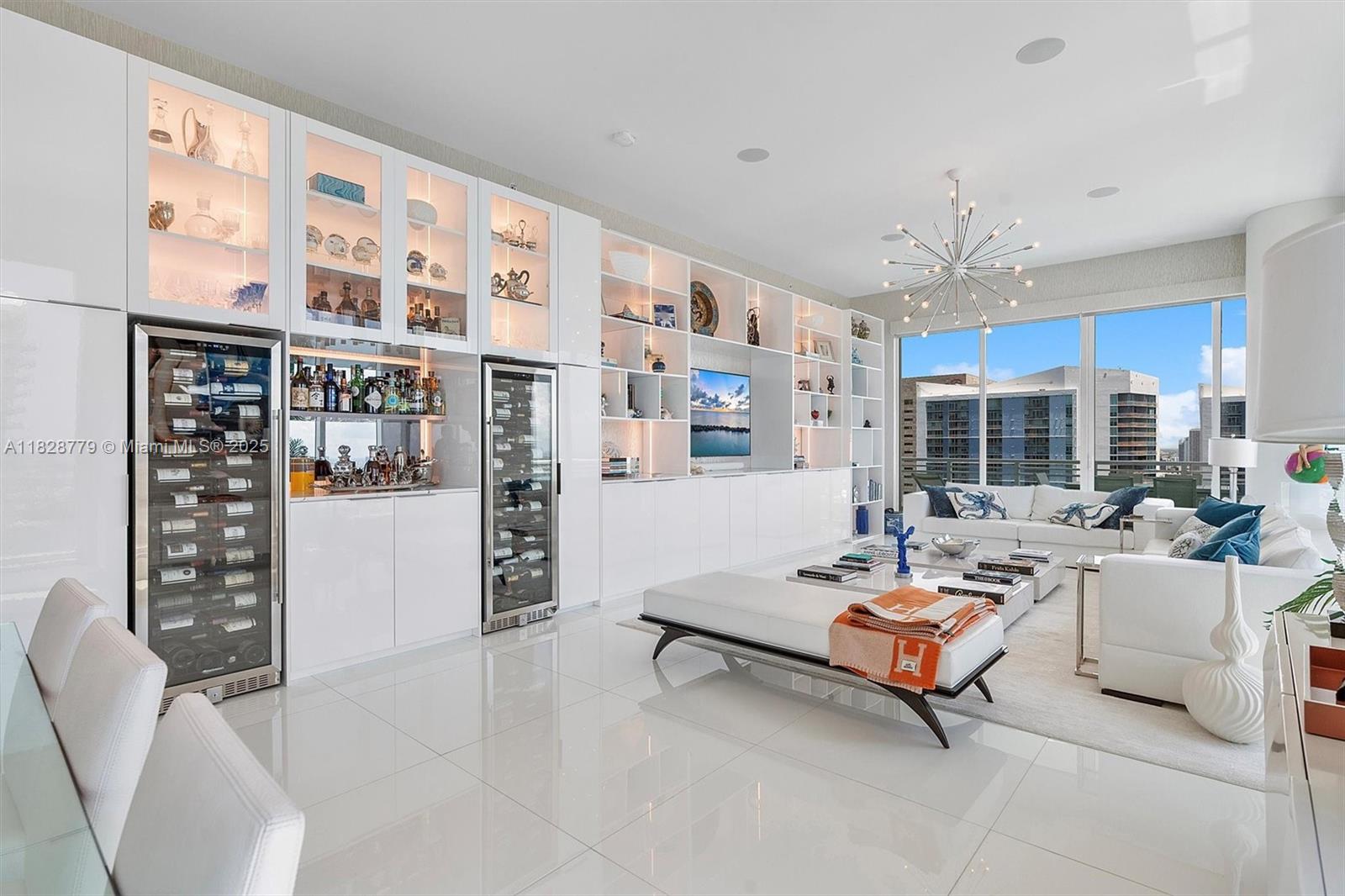900 Brickell Key Boulevard, Unit 3103 Miami, FL 33131 - Photo 6 of 55 a living room with patio furniture and a large window