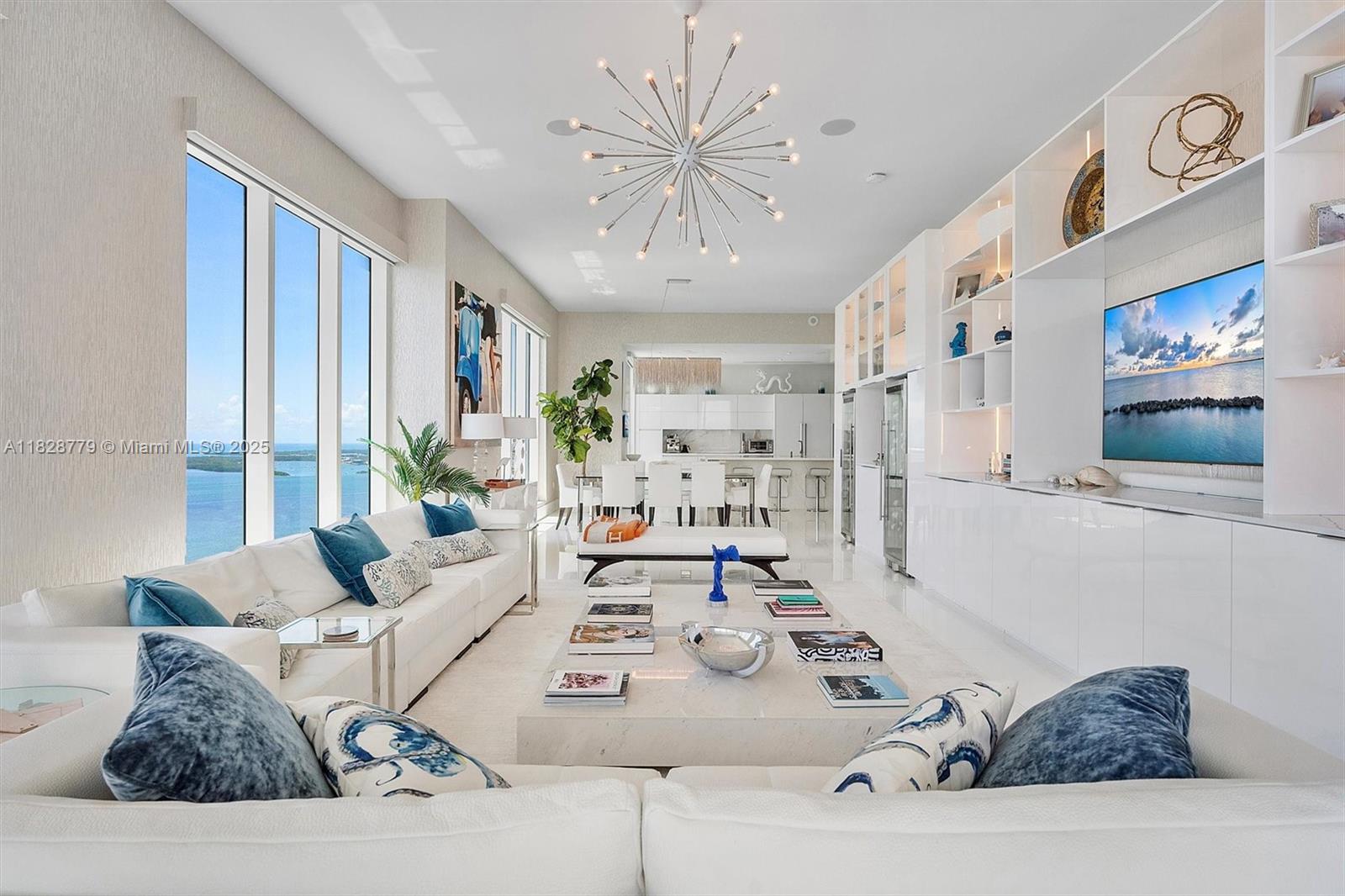 900 Brickell Key Boulevard, Unit 3103 Miami, FL 33131 - Photo 8 of 55 a living room with furniture and a large window