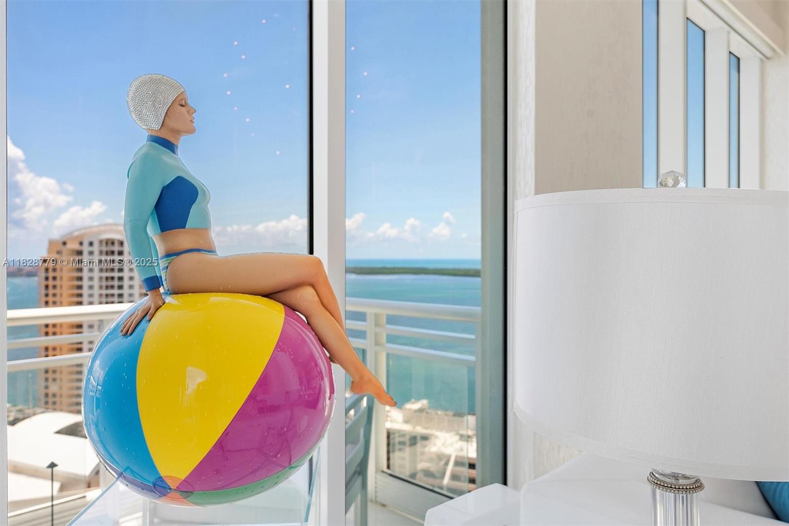 900 Brickell Key Boulevard, Unit 3103 Miami, FL 33131 - Photo 9 of 55 a view of a swimming pool with a dining room and window