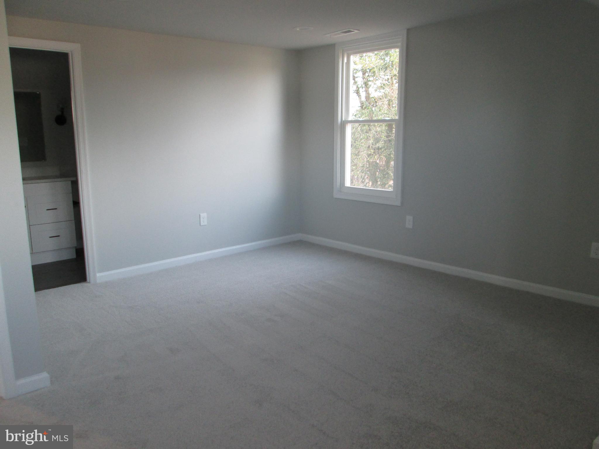 205 Wicklow Road Glen Burnie, MD 21061 - Photo 18 of 52 an empty room with windows and closet
