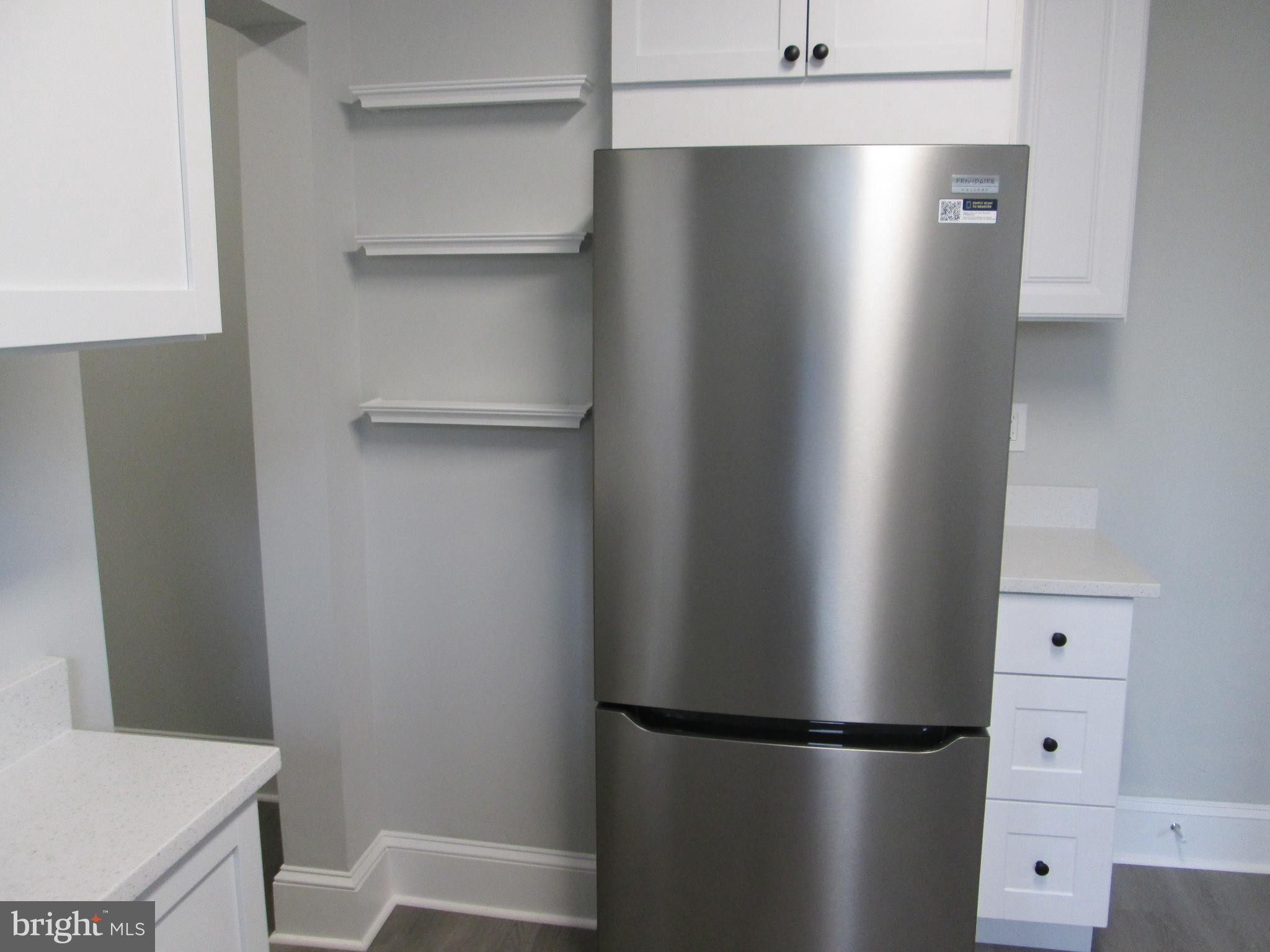 205 Wicklow Road Glen Burnie, MD 21061 - Photo 22 of 52 a view of a kitchen with refrigerator