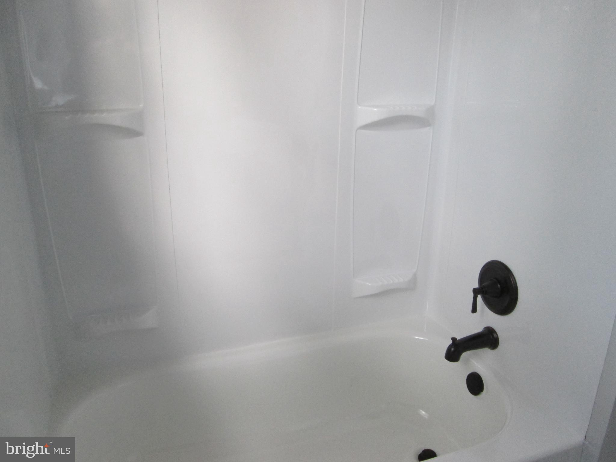 205 Wicklow Road Glen Burnie, MD 21061 - Photo 25 of 52 a bathroom with a shower