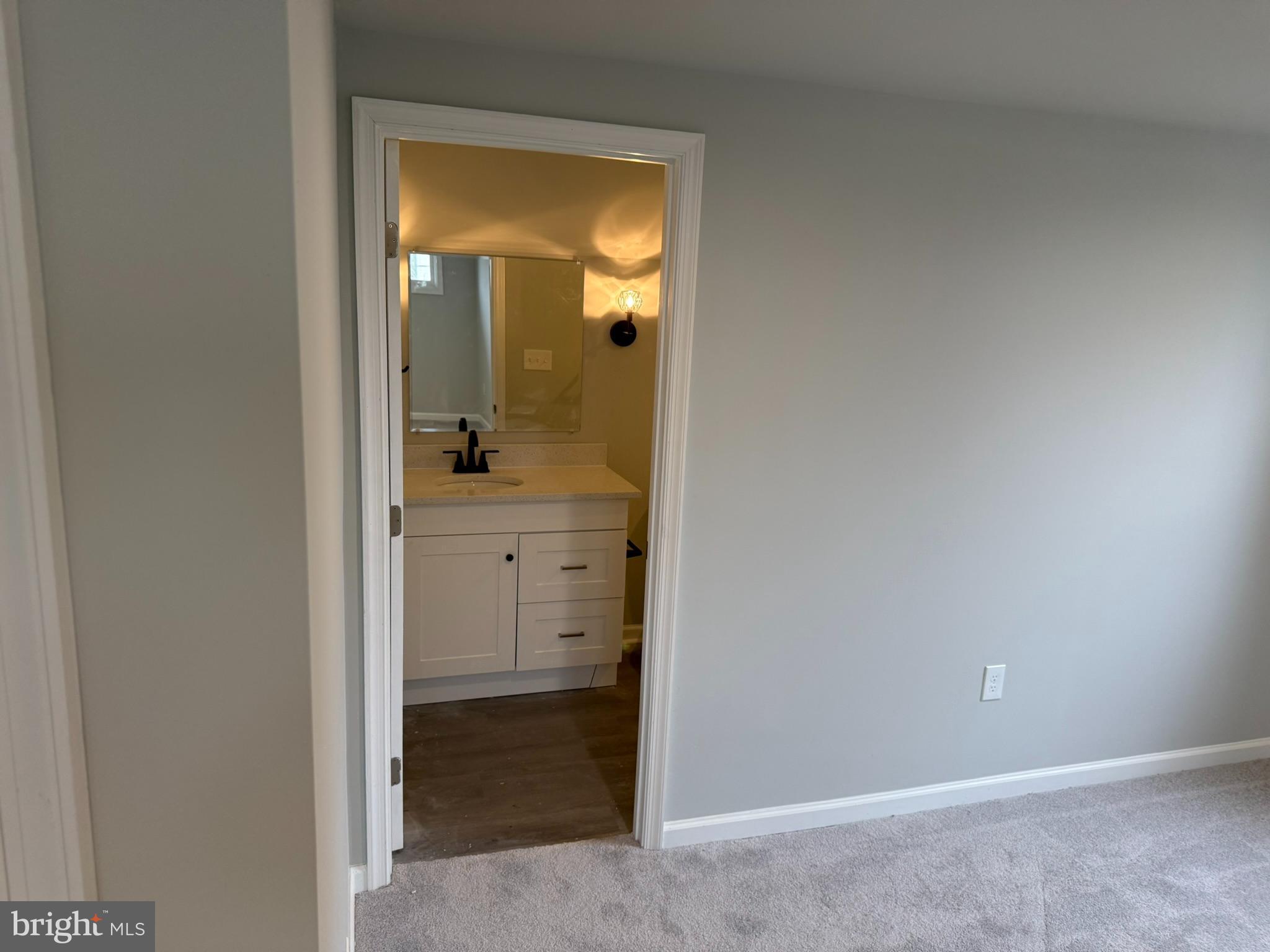 205 Wicklow Road Glen Burnie, MD 21061 - Photo 35 of 52 a view of a bathroom from a hallway