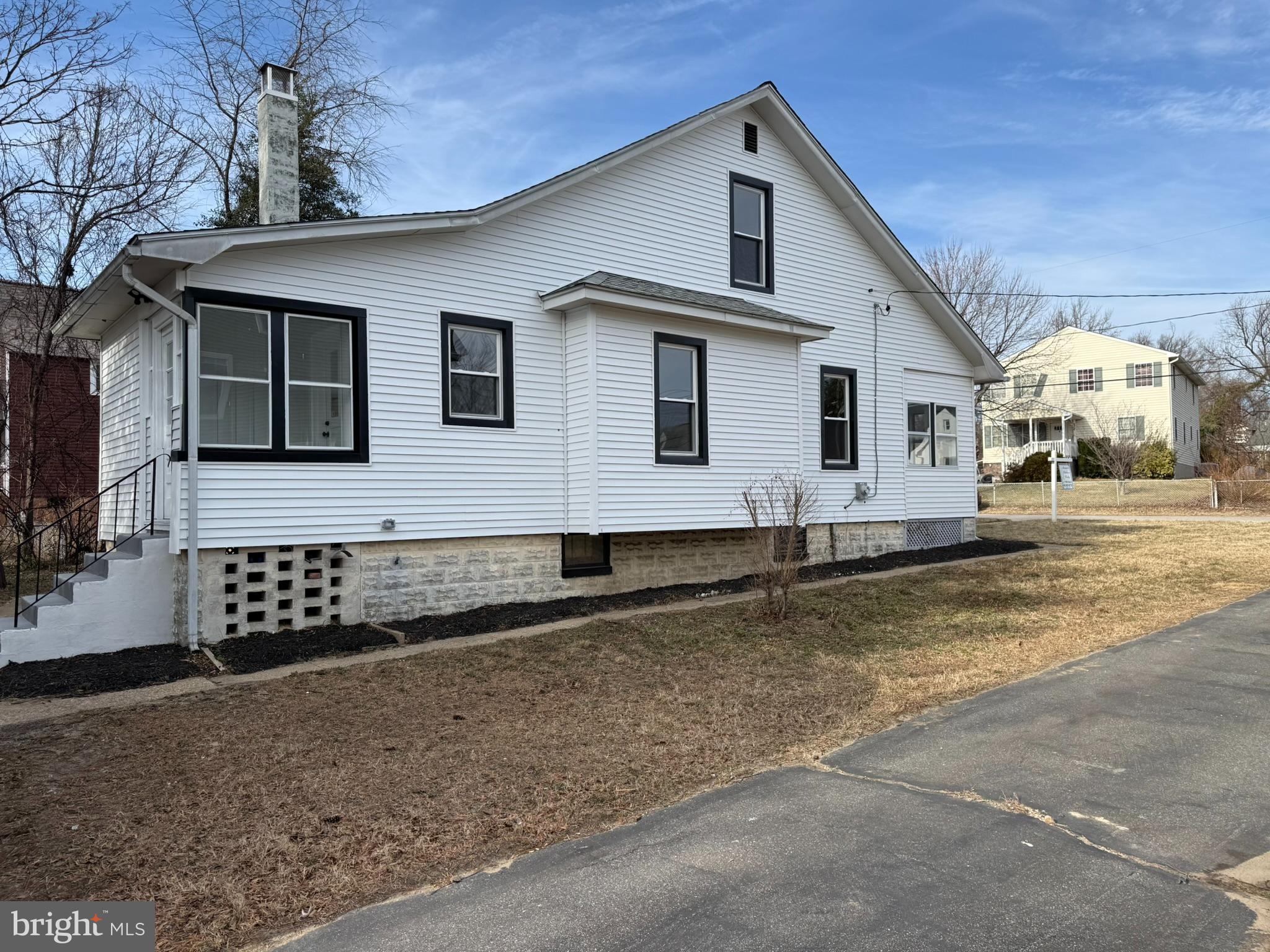 205 Wicklow Road Glen Burnie, MD 21061 - Photo 48 of 52 a front view of a house with a yard