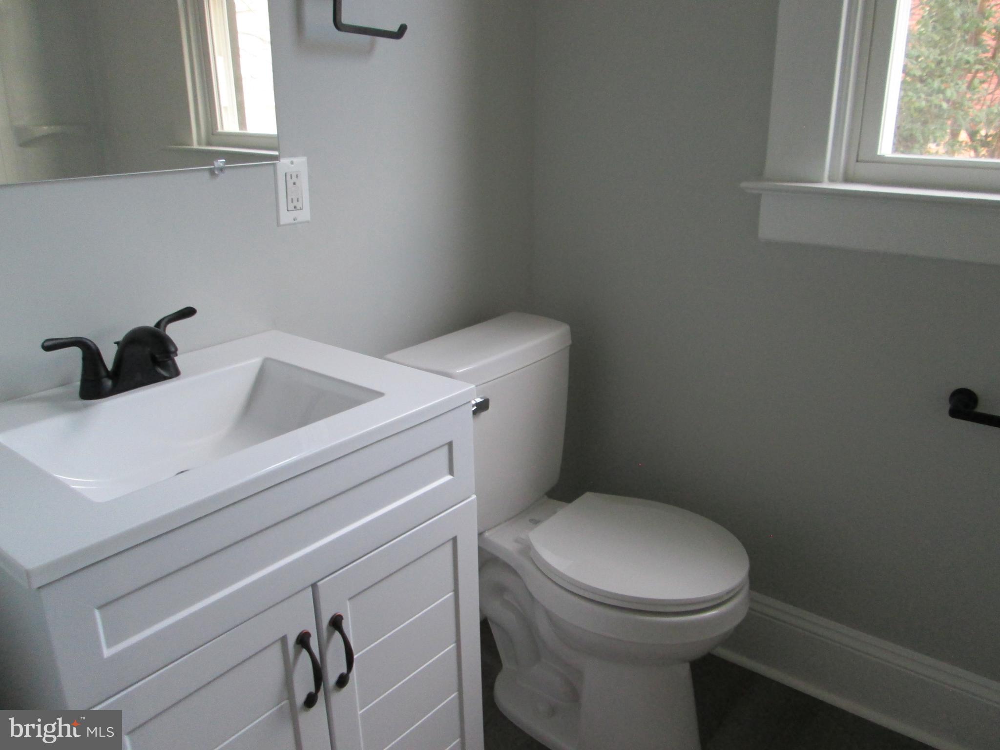 205 Wicklow Road Glen Burnie, MD 21061 - Photo 6 of 52 a white toilet sitting next to a window