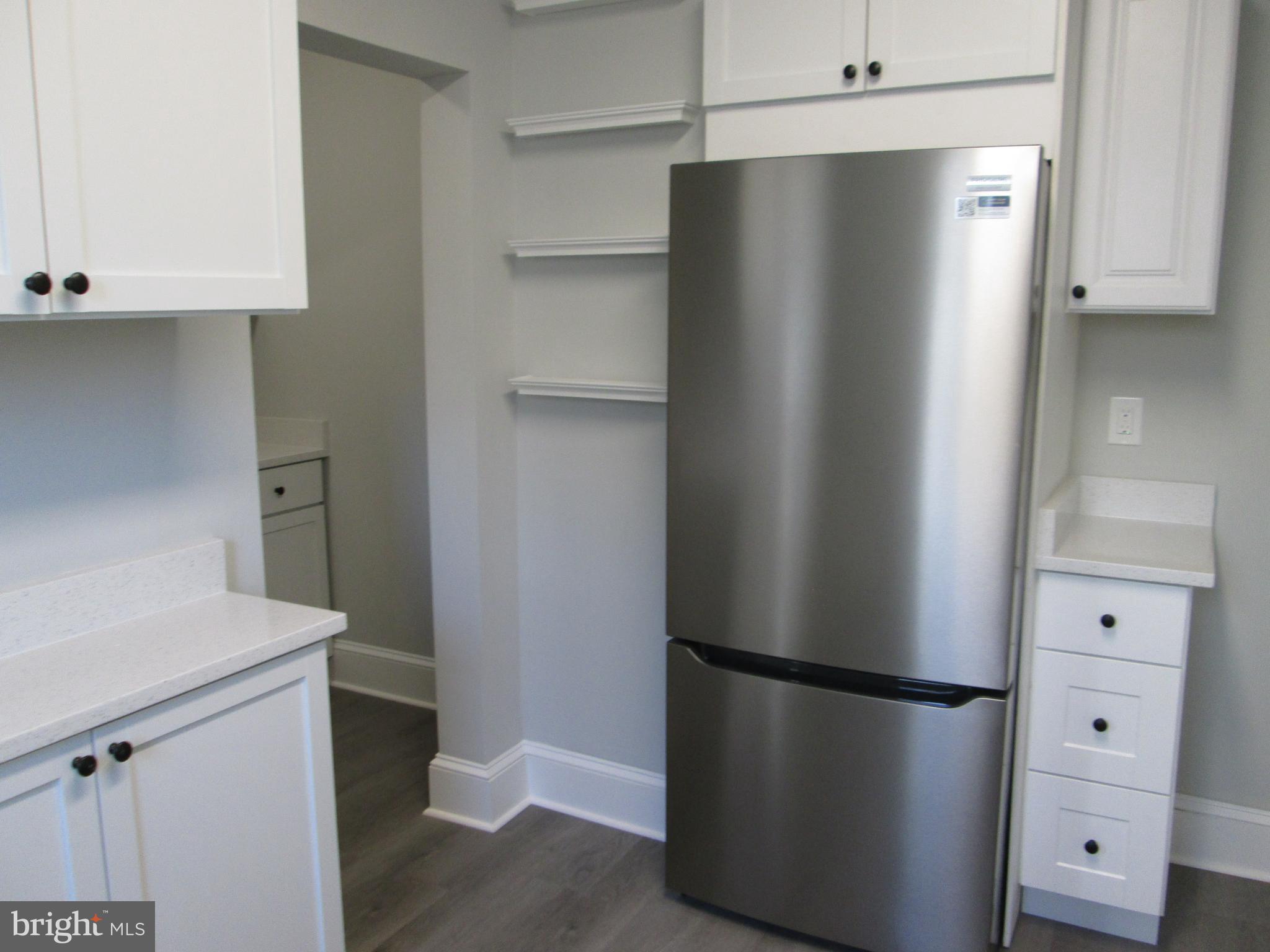 205 Wicklow Road Glen Burnie, MD 21061 - Photo 7 of 52 a view of kitchen with refrigerator stove and a sink