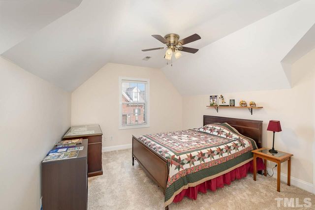 a bedroom with a bed and a table in it