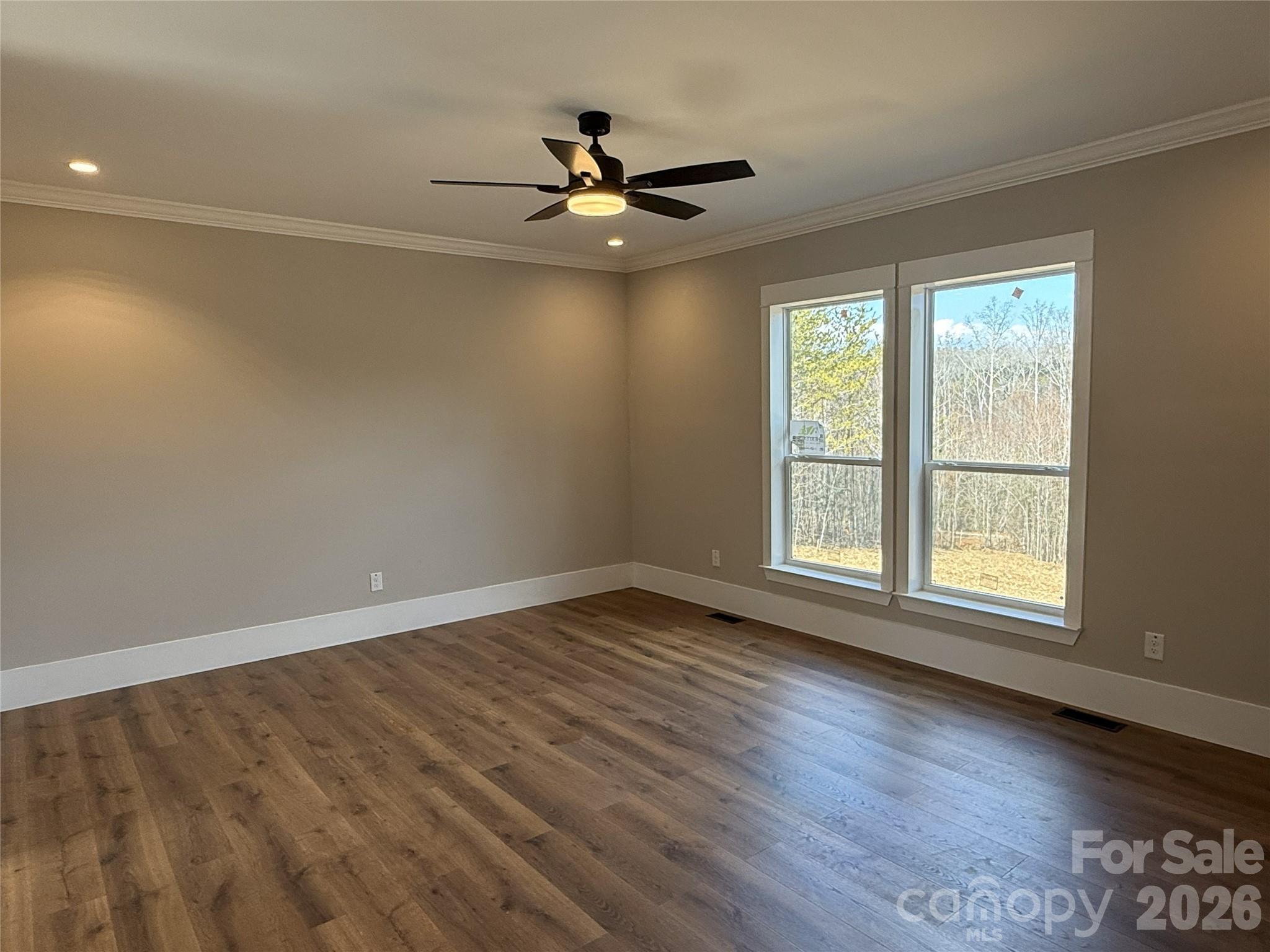 4271 Alpine Trail Morganton, NC 28655 - Photo 14 of 36 a view of an empty room with wooden floor and a window
