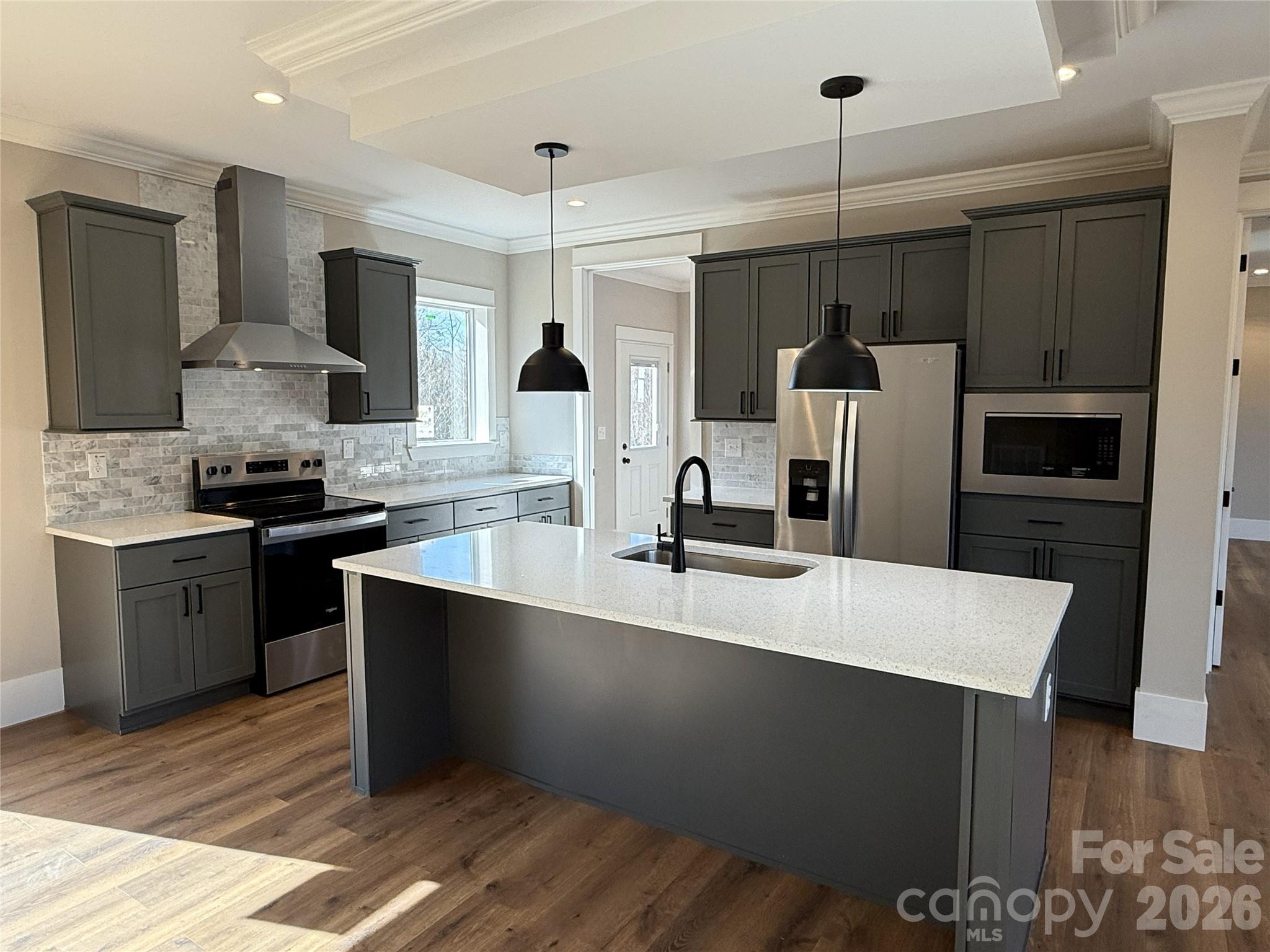 4271 Alpine Trail Morganton, NC 28655 - Photo 4 of 36 a kitchen with stainless steel appliances a sink a stove a refrigerator and cabinets