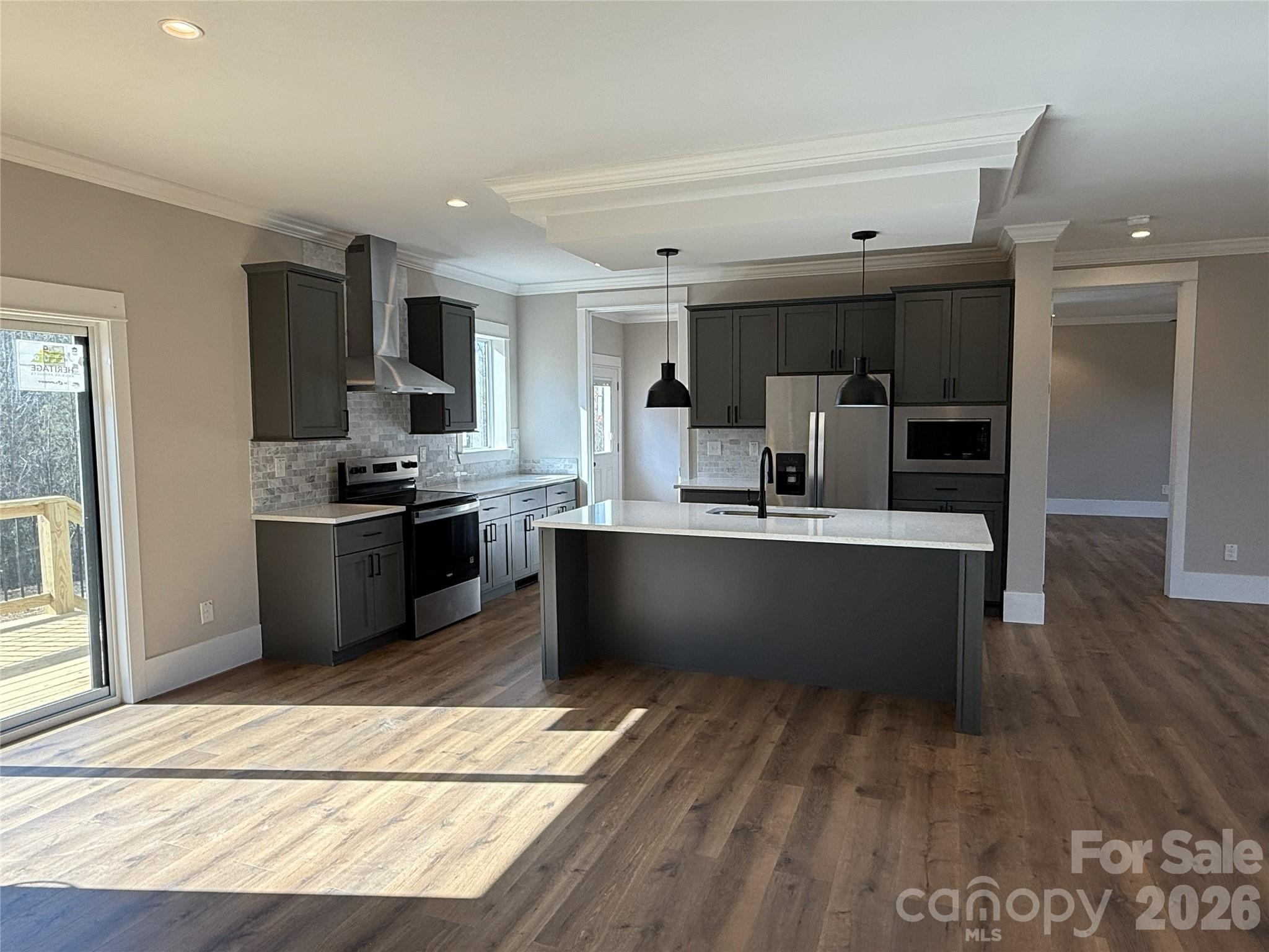 4271 Alpine Trail Morganton, NC 28655 - Photo 7 of 36 a kitchen with stainless steel appliances kitchen island granite countertop a refrigerator a sink a stove and oven