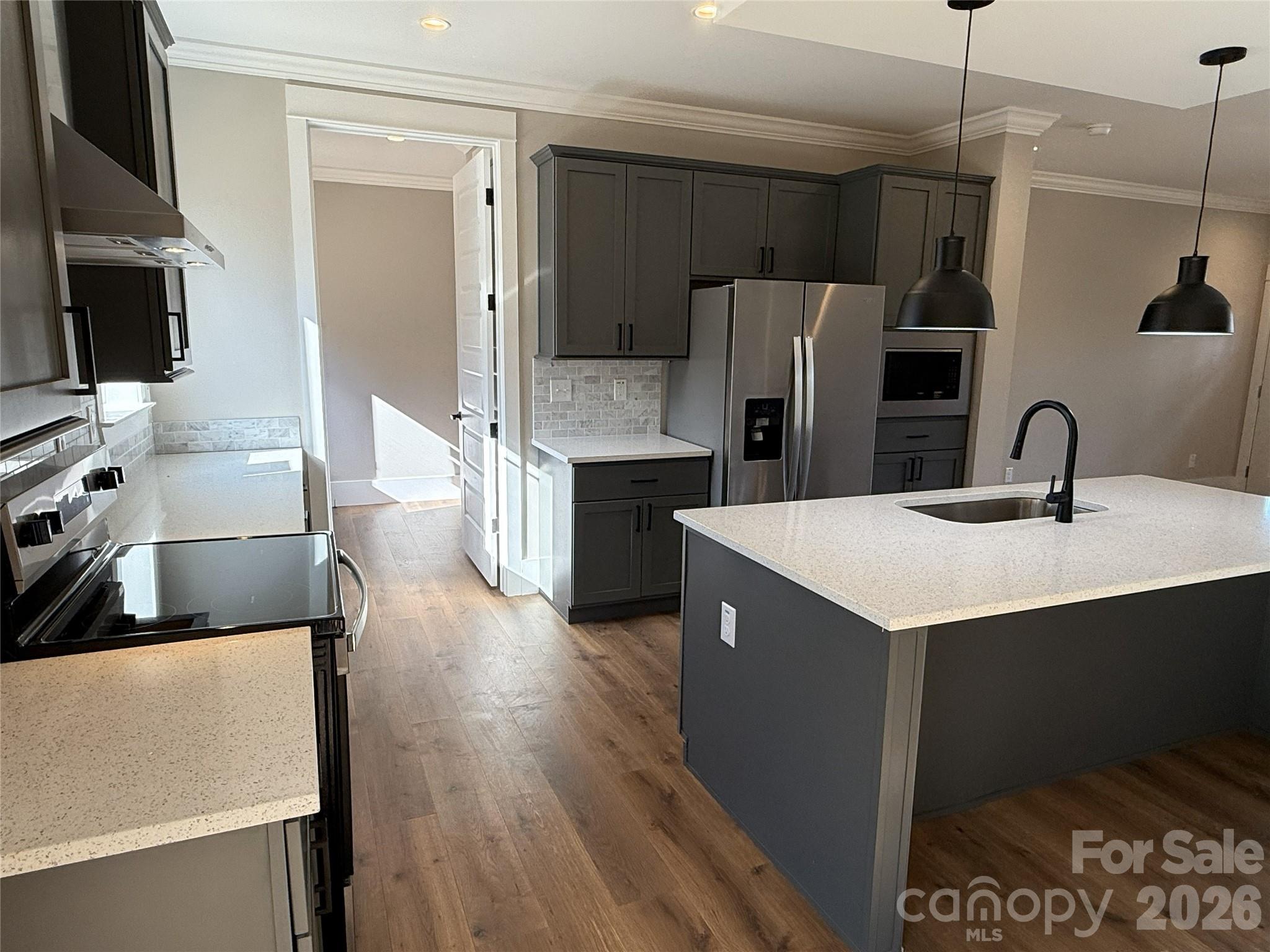 4271 Alpine Trail Morganton, NC 28655 - Photo 10 of 36 a kitchen with a refrigerator sink and an oven