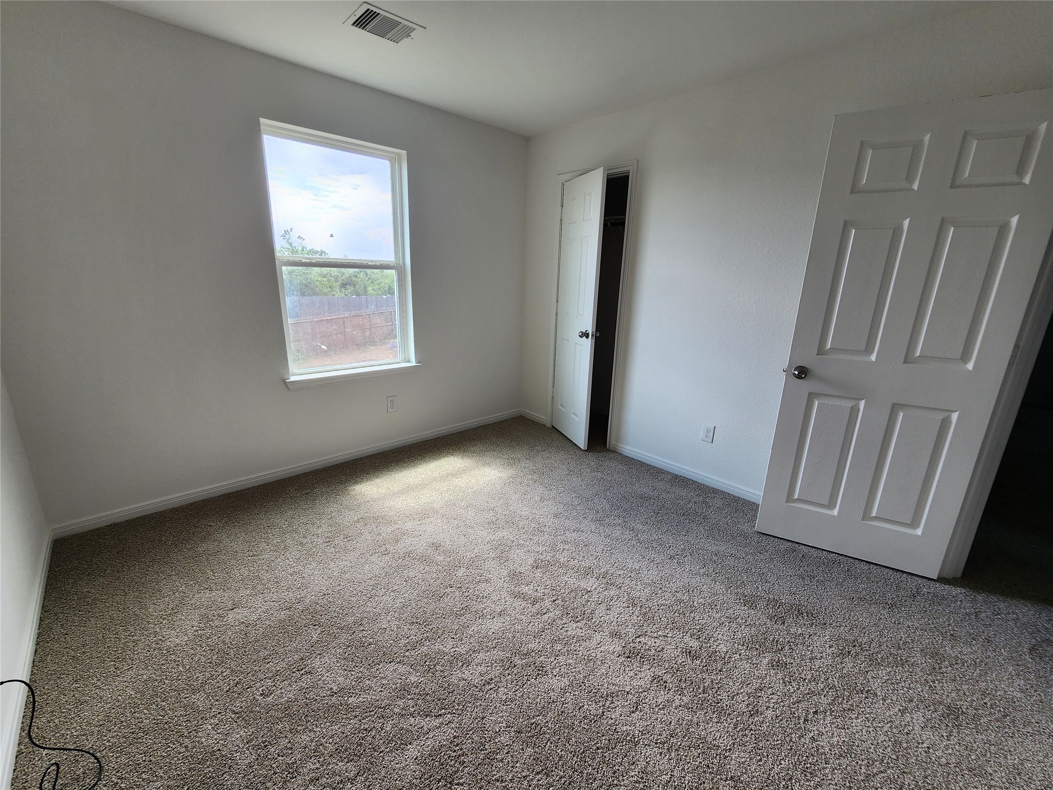 207 Branch Circle Kendleton, TX 77451 - Photo 11 of 12 an empty room with windows