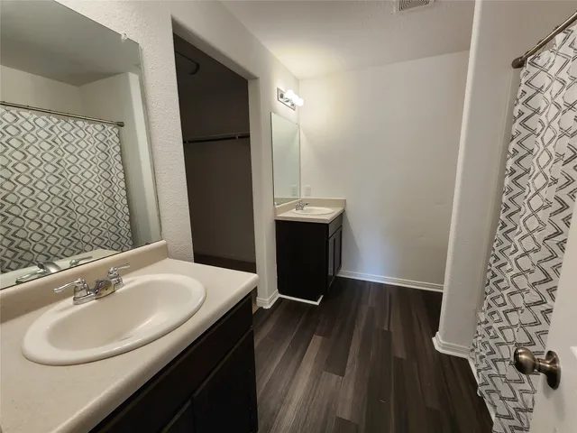 a bathroom with a sink and mirror