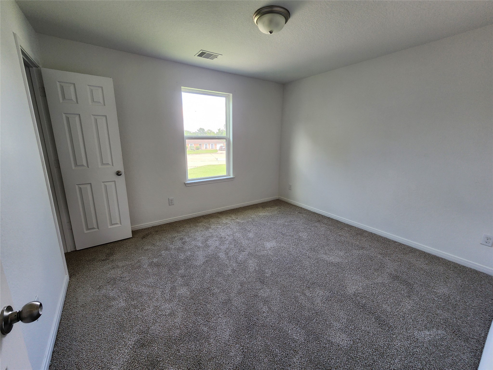 207 Branch Circle Kendleton, TX 77451 - Photo 9 of 12 an empty room with a window