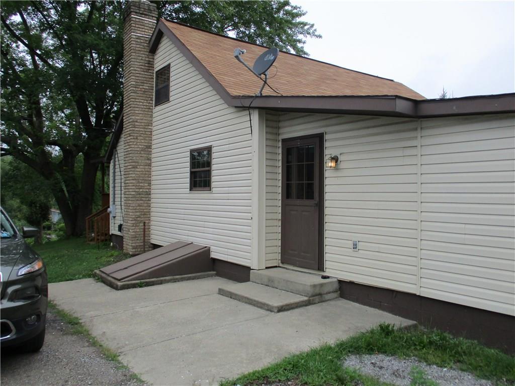 612 Glade Run Road Kittanning, PA 16201 - Photo 6 of 17 THIS IS THE DRIVEWAY SIDE OF THE HOUSE - HAS A LARGE CONCRETE PATIO FOR ENTRANCE CONVENIENCE.
