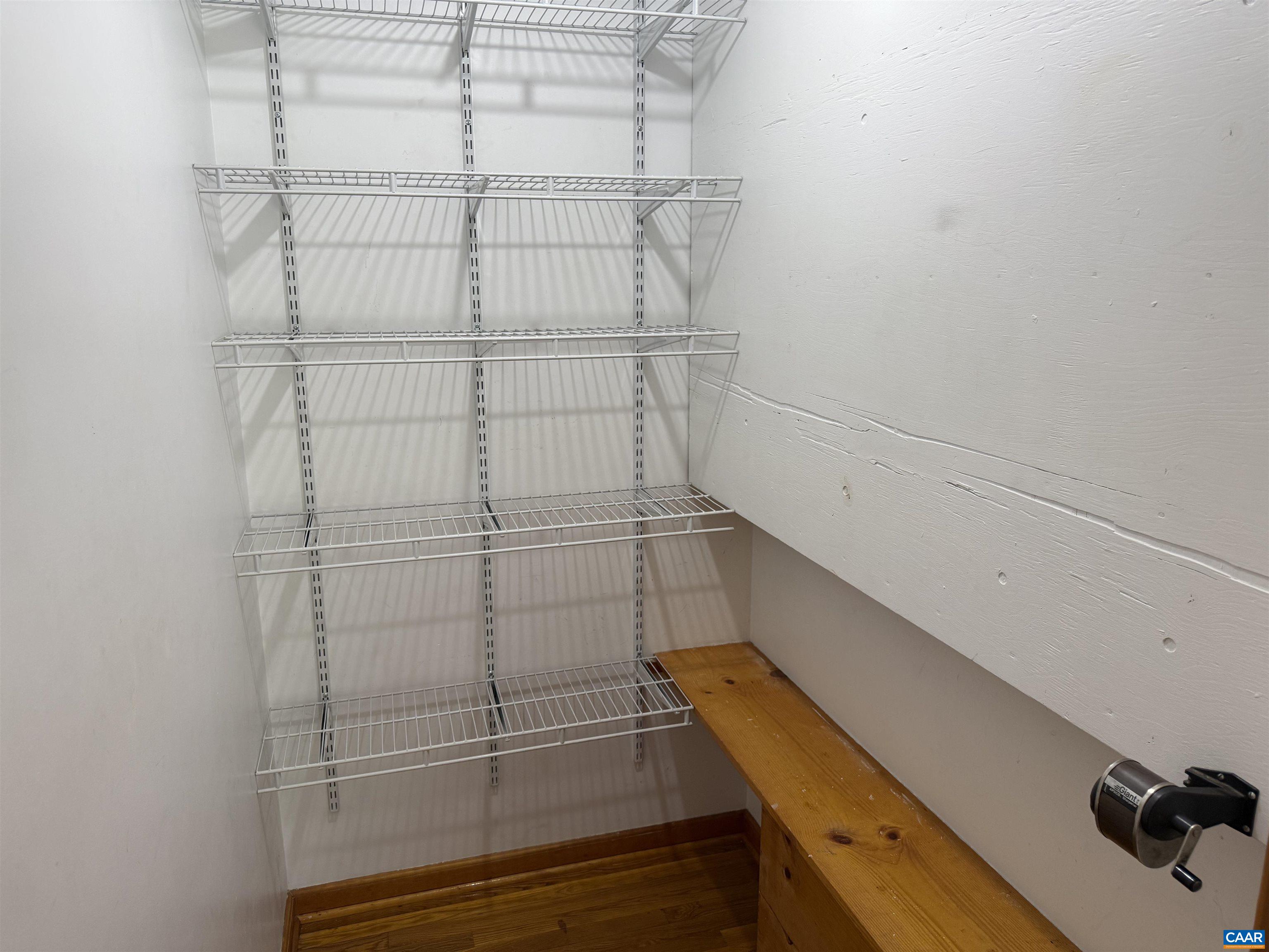 18143 Monrovia Road Orange, VA 22960 - Photo 11 of 43 a view of a room with racks on the wall