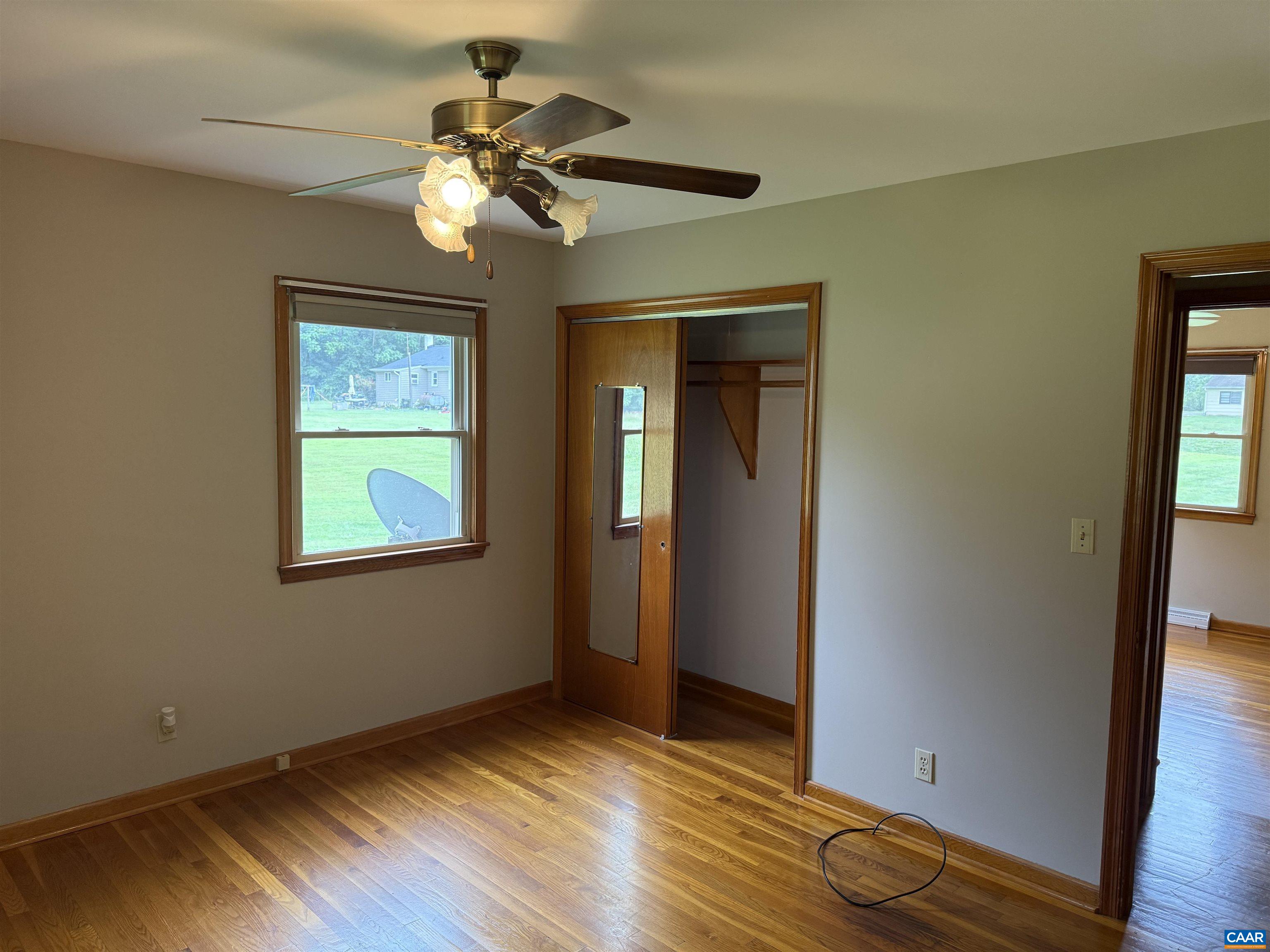 18143 Monrovia Road Orange, VA 22960 - Photo 14 of 43 a view of an empty room with wooden floor and a window