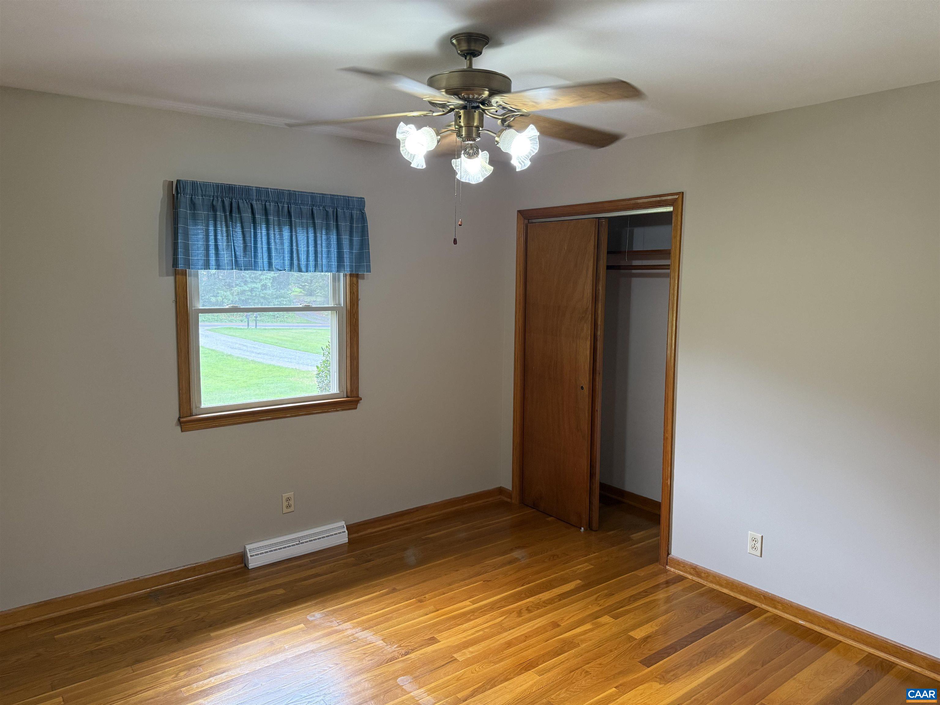 18143 Monrovia Road Orange, VA 22960 - Photo 17 of 43 a view of an empty room with wooden floor and a window