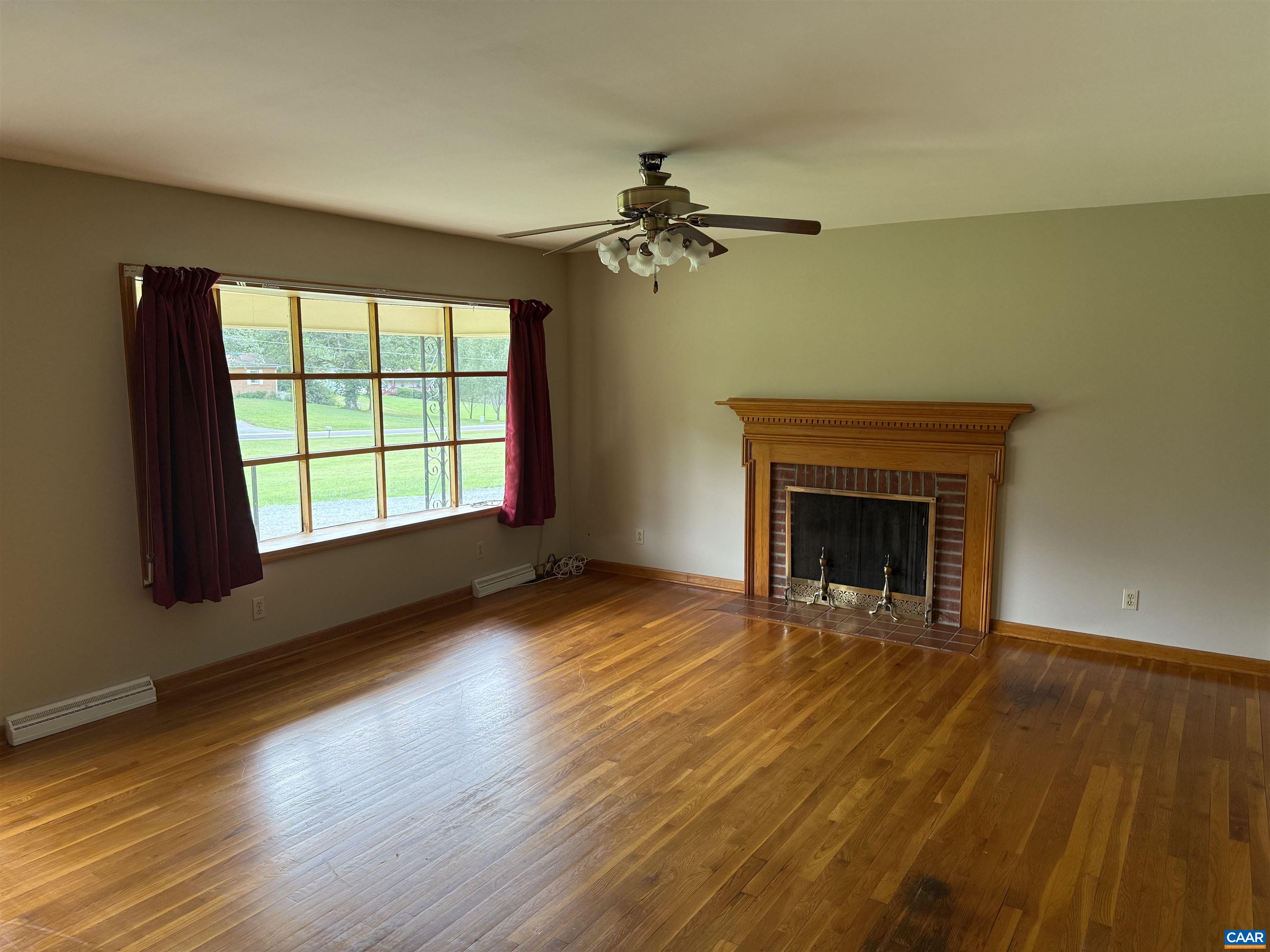 18143 Monrovia Road Orange, VA 22960 - Photo 2 of 43 wooden floor fireplace and windows in an empty room