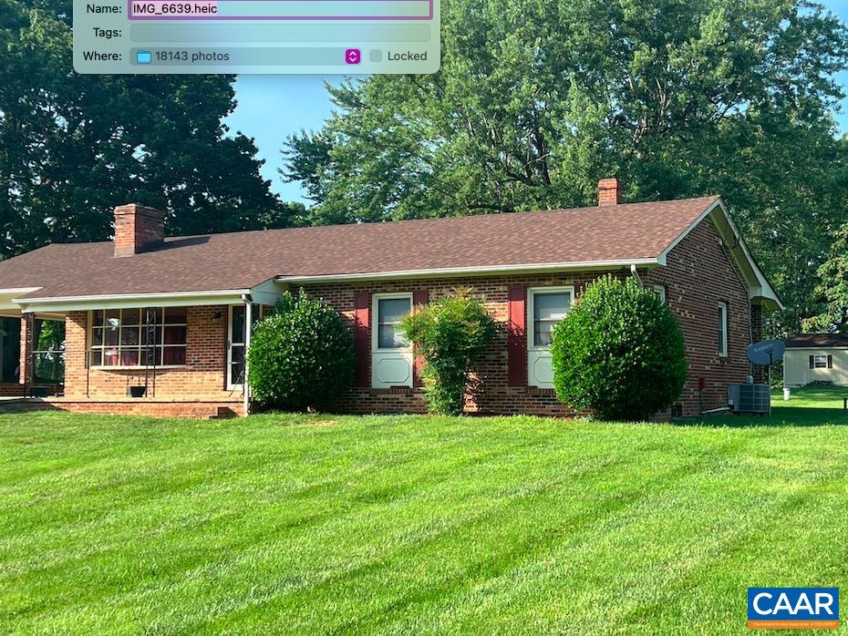 18143 Monrovia Road Orange, VA 22960 - Photo 32 of 43 a front view of a house with a yard and trees