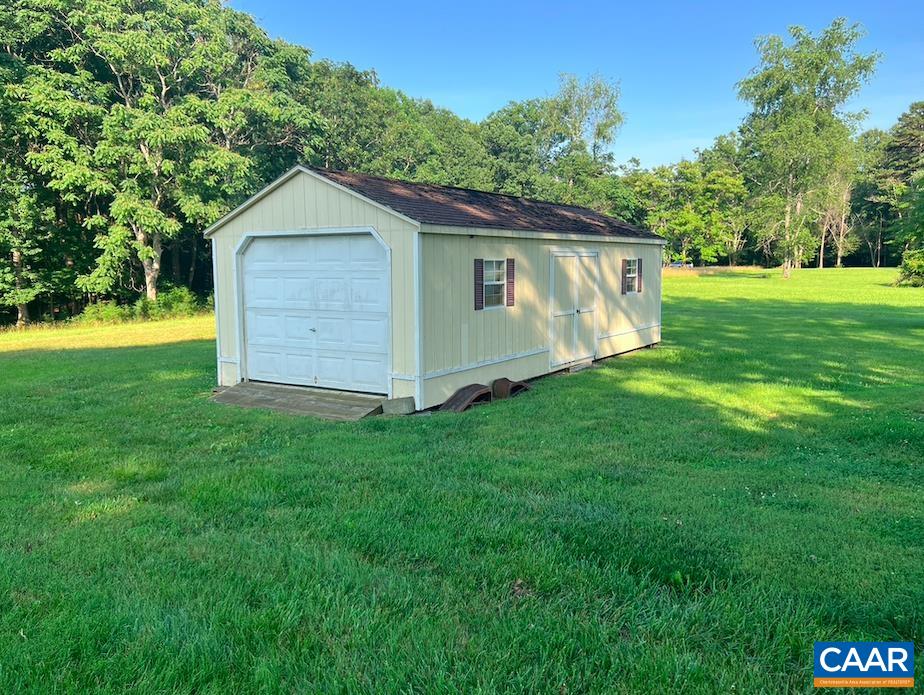 18143 Monrovia Road Orange, VA 22960 - Photo 38 of 43 a view of a backyard with barn and large trees