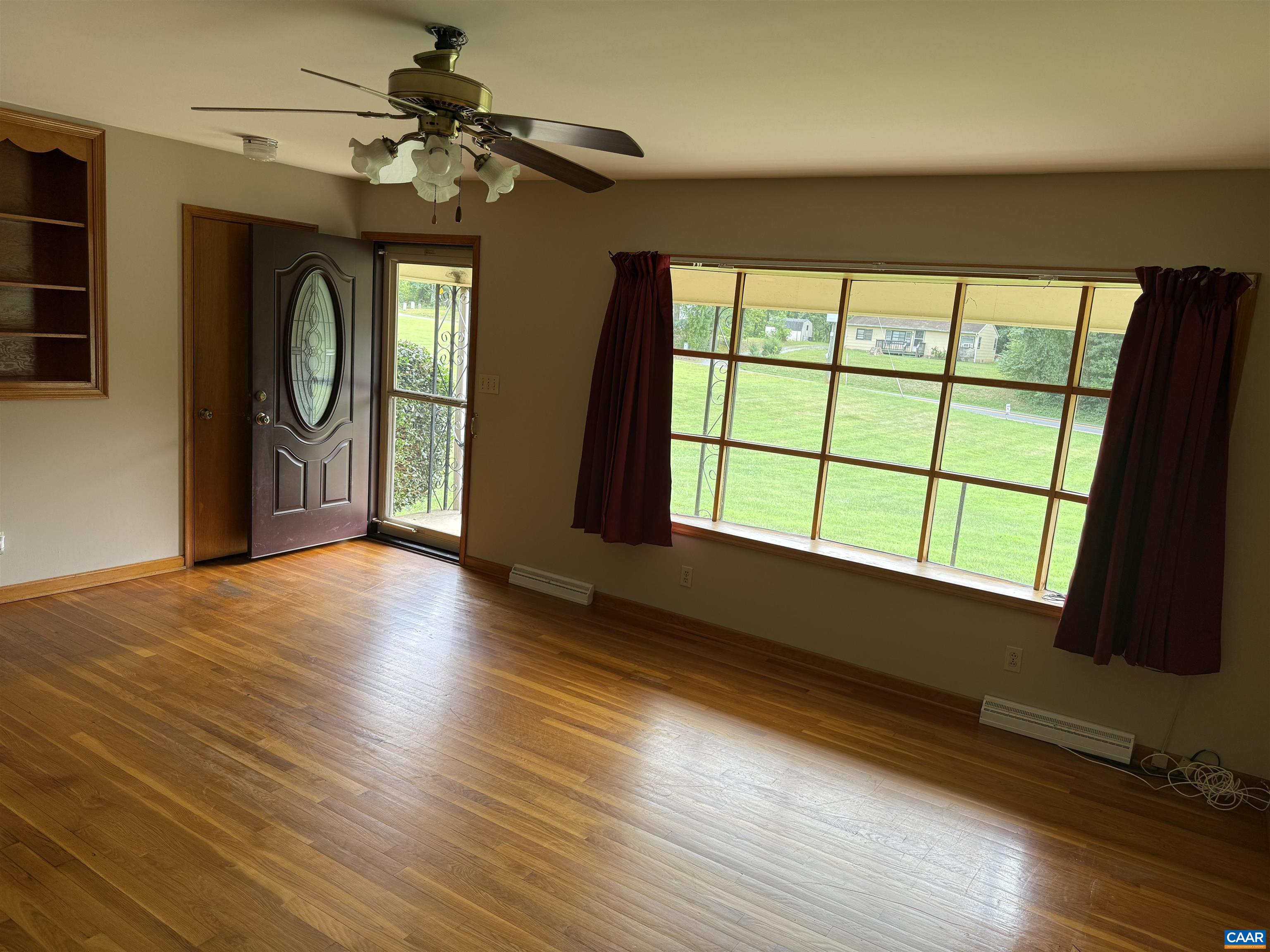 18143 Monrovia Road Orange, VA 22960 - Photo 4 of 43 a view of an empty room with a window and wooden floor
