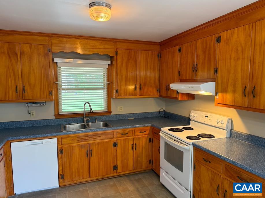 18143 Monrovia Road Orange, VA 22960 - Photo 8 of 43 a kitchen with a sink stove and cabinets