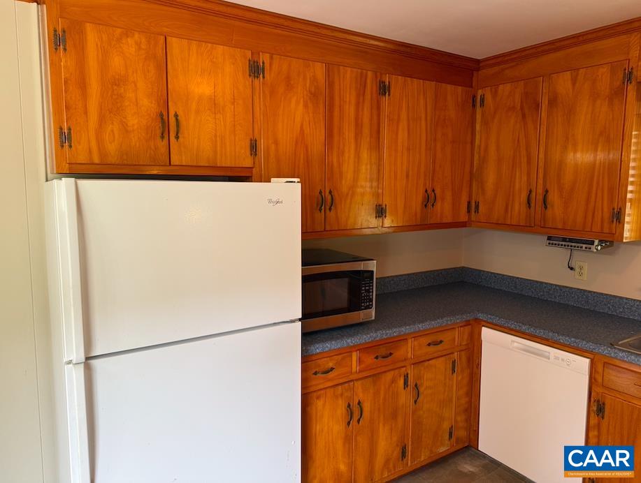 18143 Monrovia Road Orange, VA 22960 - Photo 9 of 43 a white refrigerator freezer sitting in a kitchen