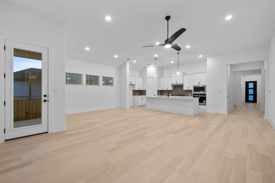 19505 Judys View Pflugerville, TX 78660 - Photo 9 of 25 From Family Room to Open Concept Kitchen