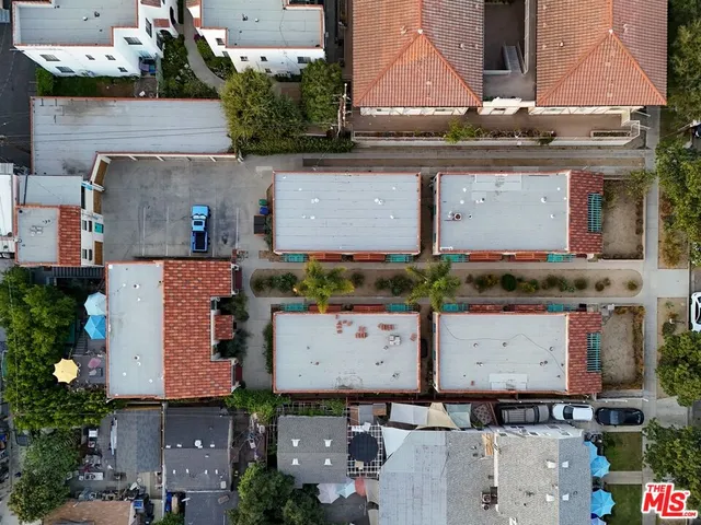 an aerial view of residential houses with outdoor space