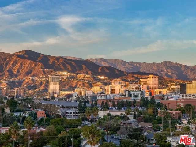 a view of a city with a building in the background