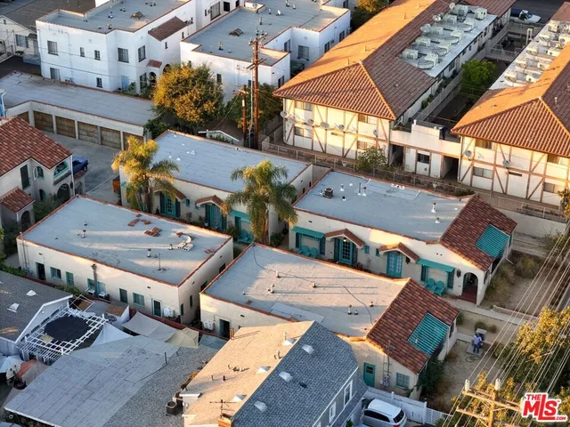 an aerial view of a houses with outdoor space