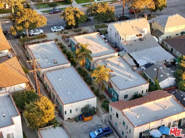 an aerial view of a residential houses with outdoor space