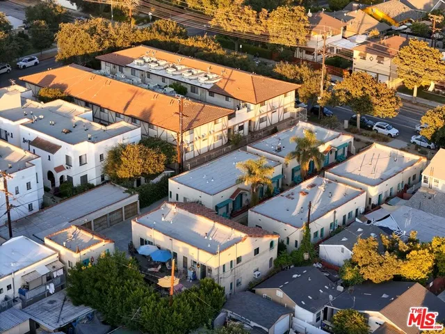 an aerial view of a house with a swimming pool
