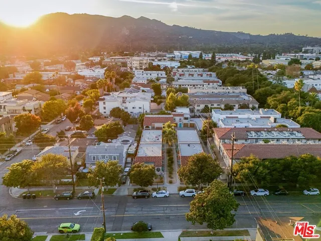 an aerial view of residential houses and outdoor space