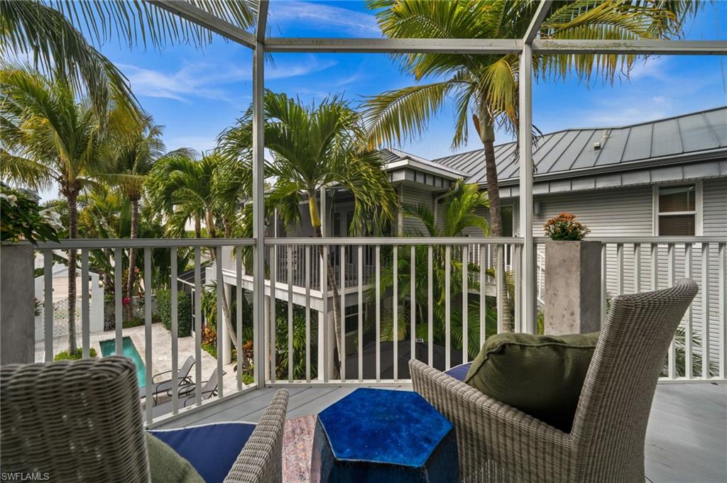 361 2nd Street South Naples, FL 34102 - Photo 13 of 31 a view of a chairs and table in patio of a house