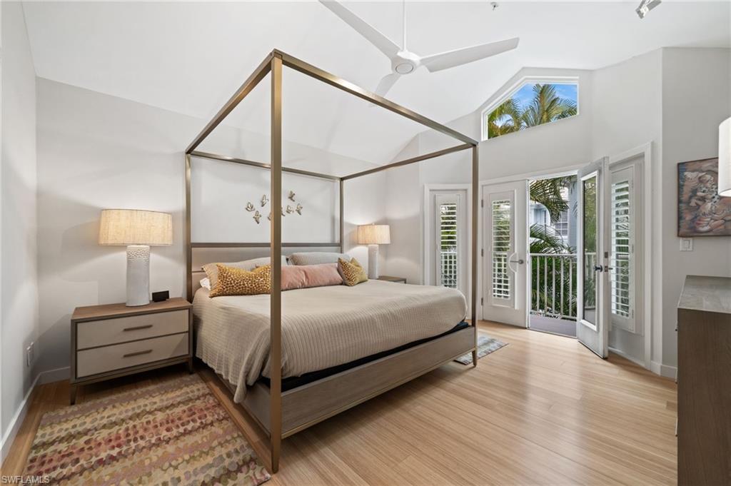 361 2nd Street South Naples, FL 34102 - Photo 14 of 31 a bedroom with a bed lamp and a large window