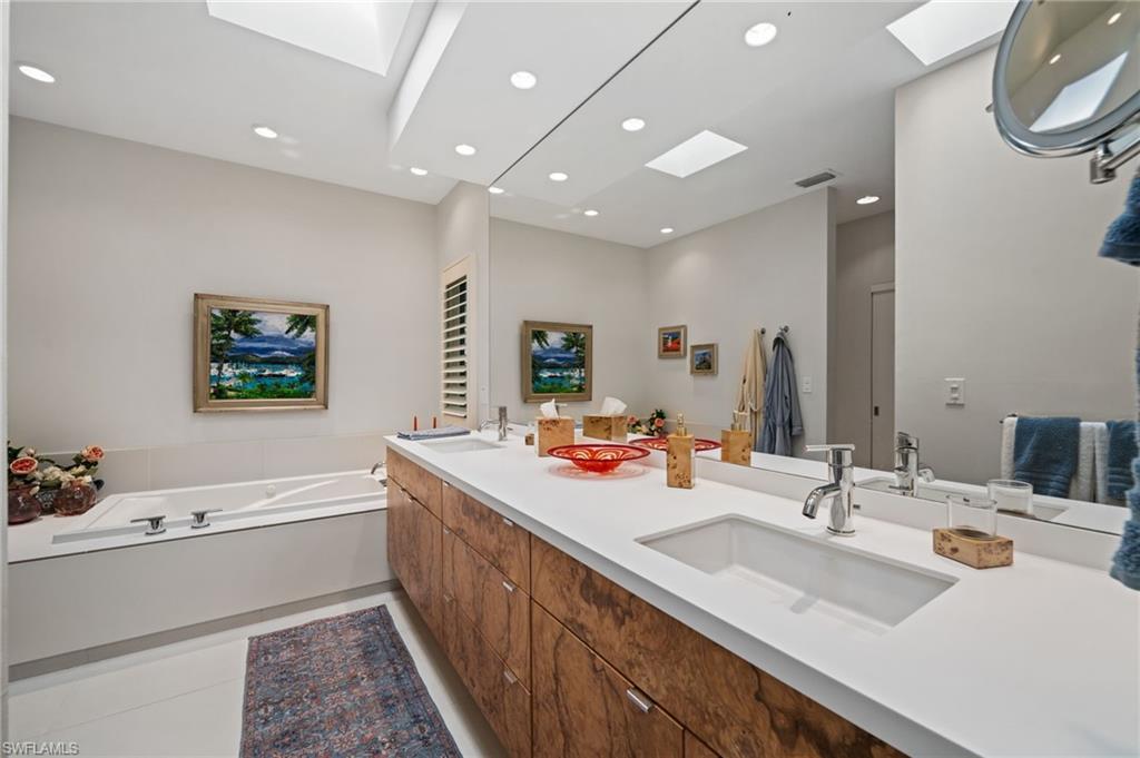 361 2nd Street South Naples, FL 34102 - Photo 17 of 31 a bathroom with a sink double vanity and a mirror
