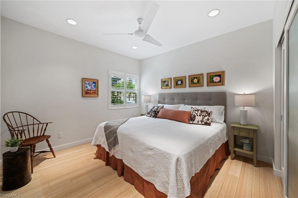 361 2nd Street South Naples, FL 34102 - Photo 19 of 31 a bedroom with a bed and a table
