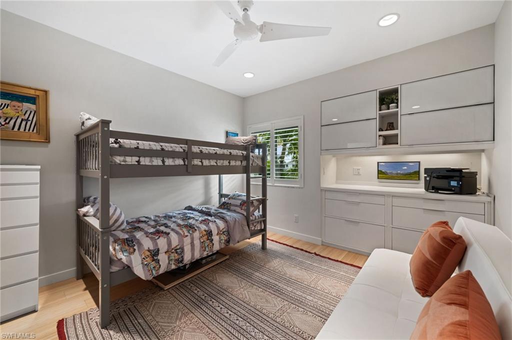 361 2nd Street South Naples, FL 34102 - Photo 20 of 31 a bedroom with a bed and a tv