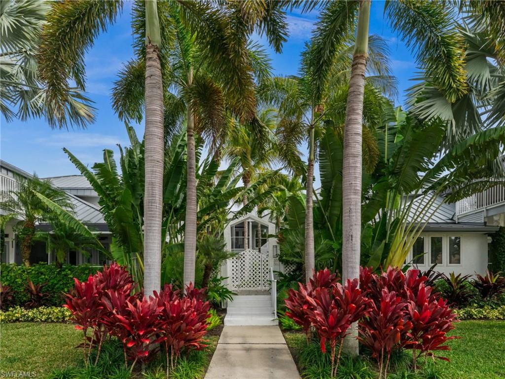 361 2nd Street South Naples, FL 34102 - Photo 24 of 31 a front view of a house with a garden