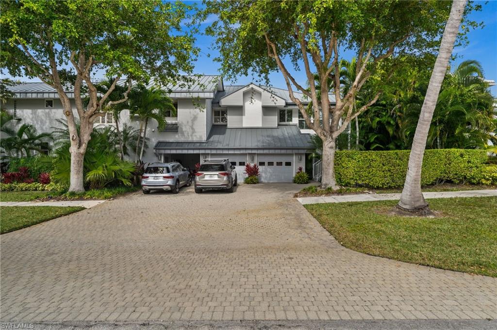 361 2nd Street South Naples, FL 34102 - Photo 26 of 31 a car parked in front of house with a yard