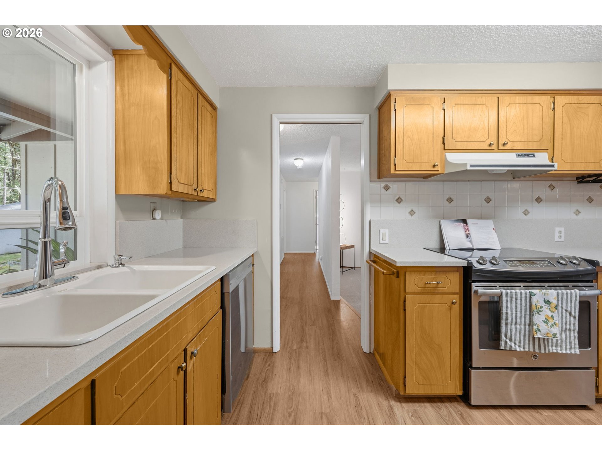 91638 Horse Creek Road Blue River, OR 97413 - Photo 11 of 47 a kitchen with stainless steel appliances granite countertop a sink stove and cabinets