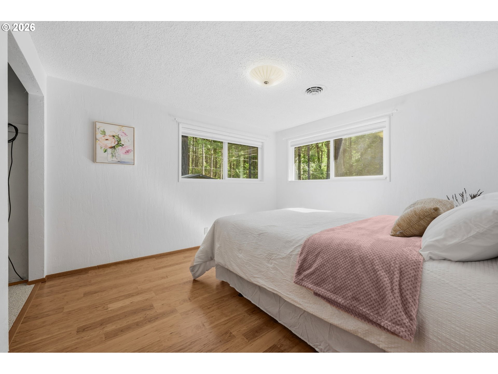 91638 Horse Creek Road Blue River, OR 97413 - Photo 24 of 47 a bedroom with a bed and a night stand
