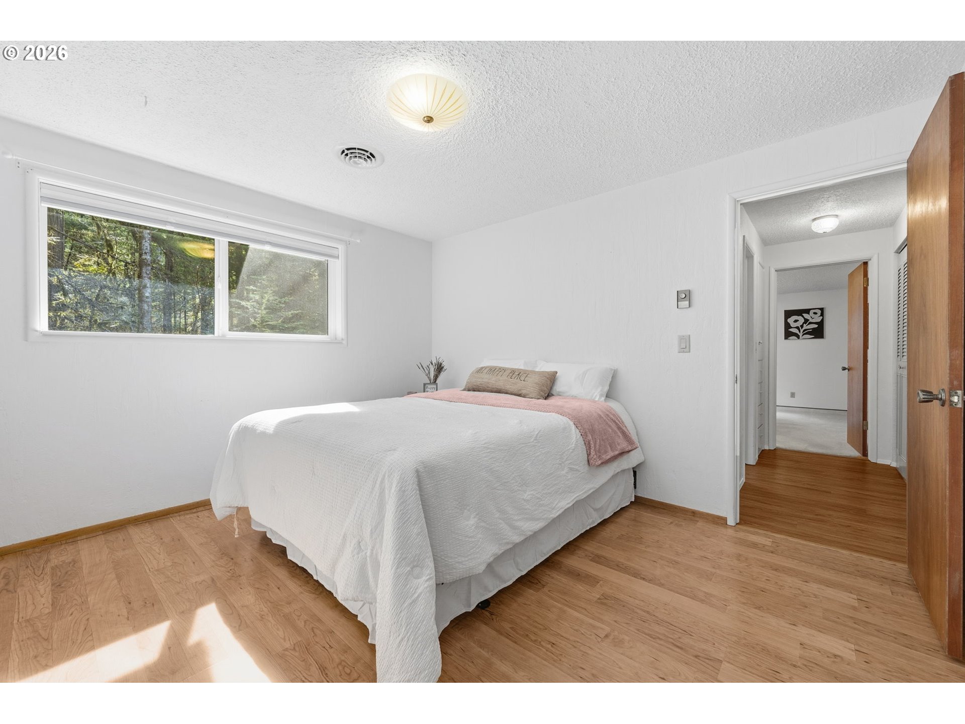 91638 Horse Creek Road Blue River, OR 97413 - Photo 25 of 47 a bedroom with a bed and a night stand