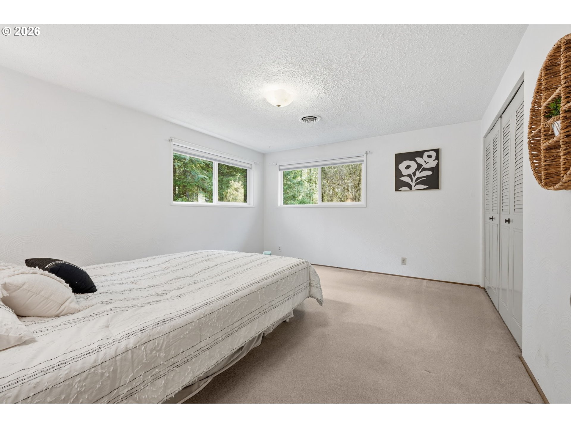 91638 Horse Creek Road Blue River, OR 97413 - Photo 28 of 47 a bedroom with a bed and a window