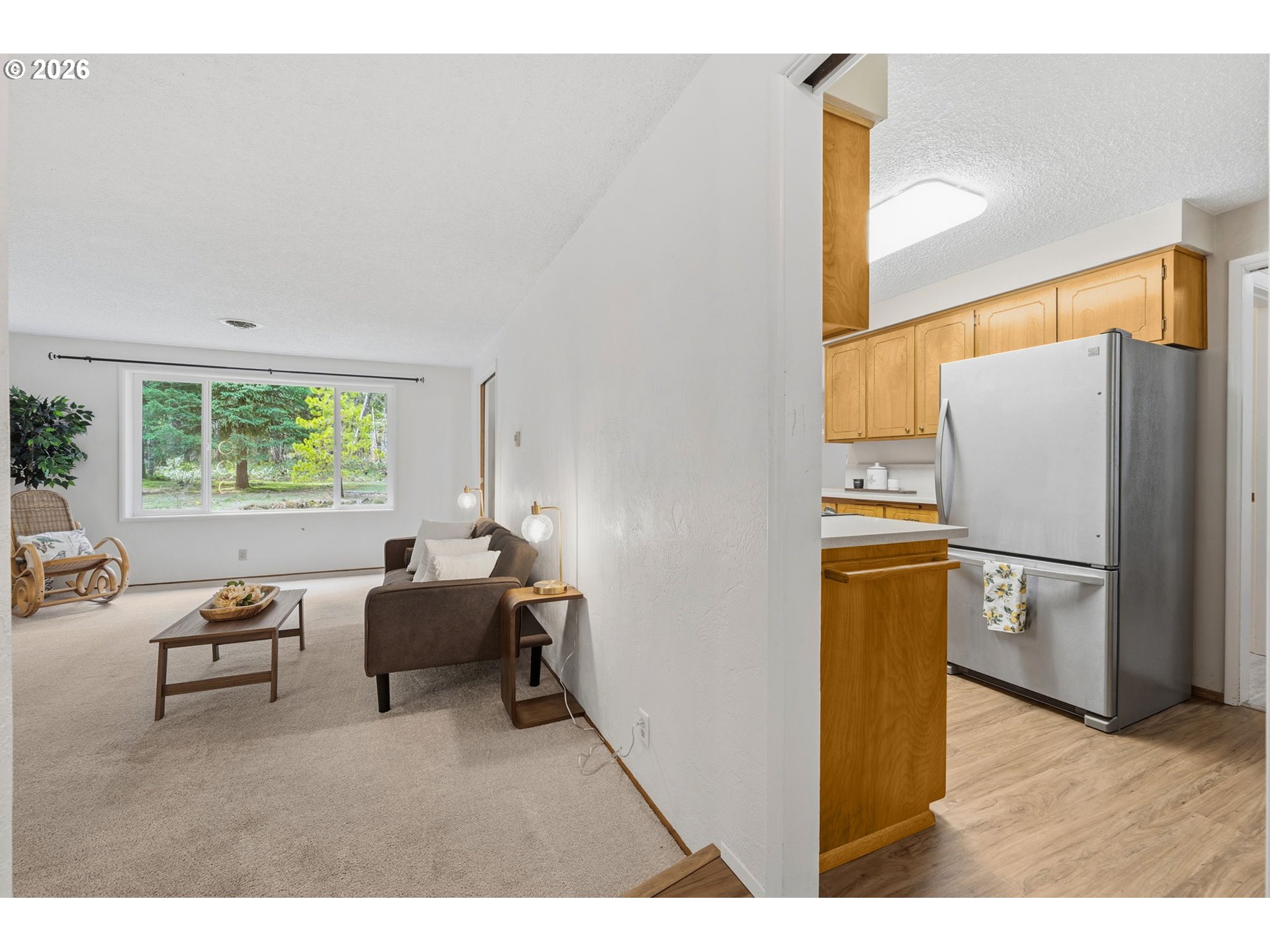 91638 Horse Creek Road Blue River, OR 97413 - Photo 10 of 47 a living room with furniture a refrigerator and a table