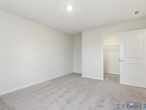 an empty room with wooden floor