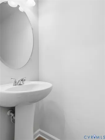 a bathroom with a sink and mirror
